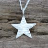 Sterling silver line hammered mini star pendant